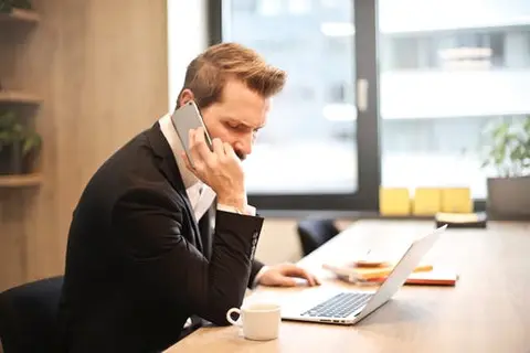 A solicitor on the telephone to a client